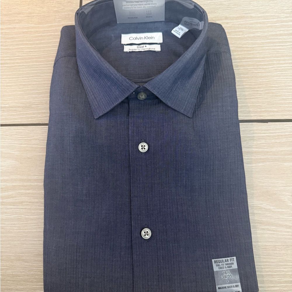 Brand new meens size large Calvin Klein Men's Navy Shirt regualr fit